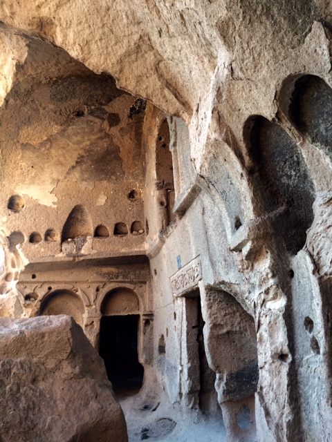 Cappadocia Rock-cut cave cathedral, cave church with flagellation column, and fairy castles in the lava flow canyons